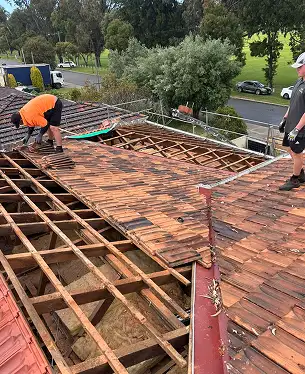 tilers re-roofing a roof